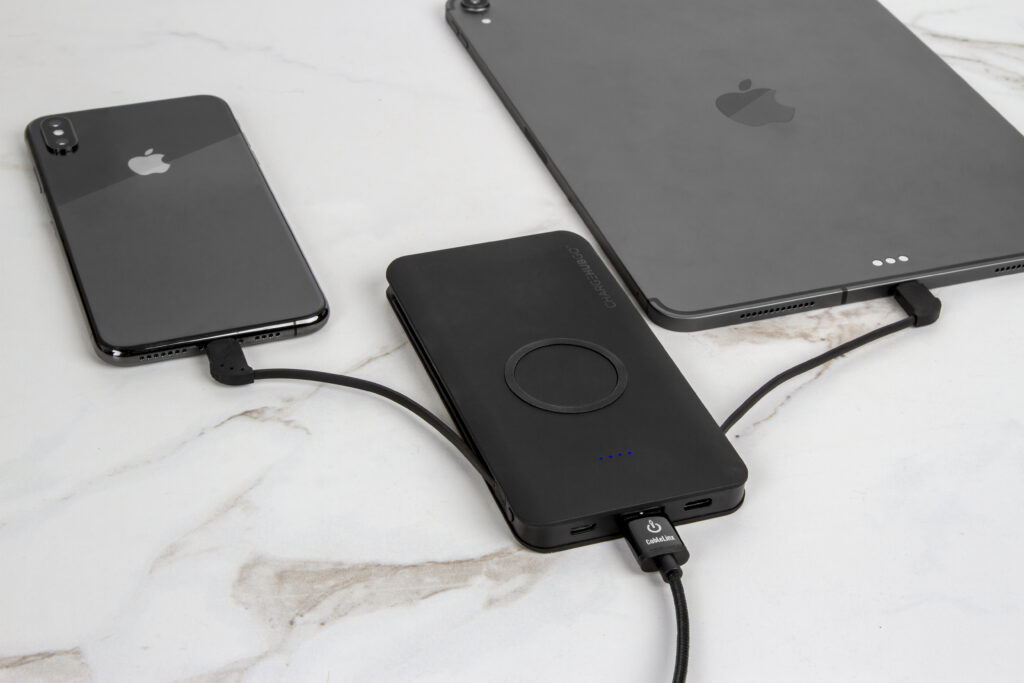 iPhone and iPad being charged from a wireless charger