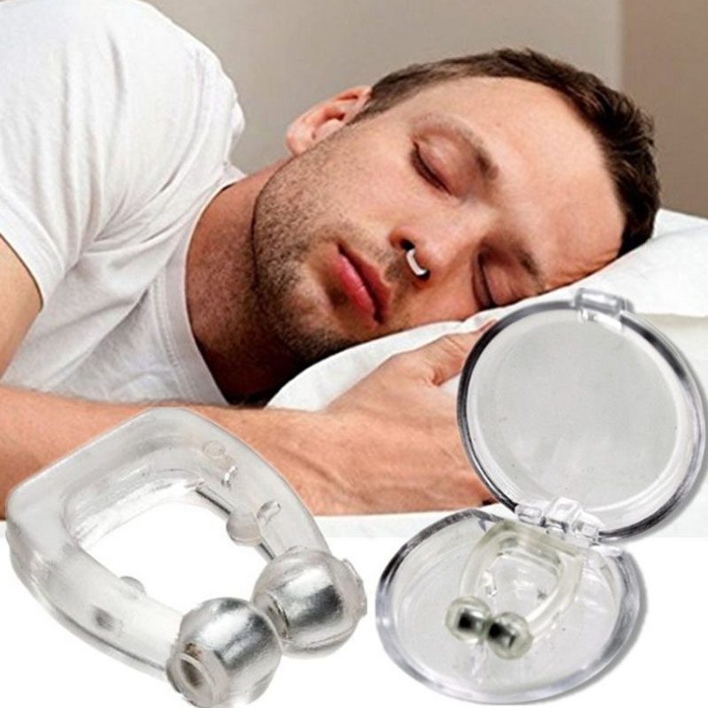 A boy using the bluegadget nasal clip to prevent snoring