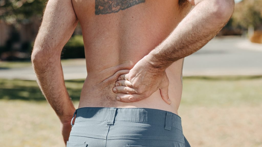A person experiencing chronic back pain